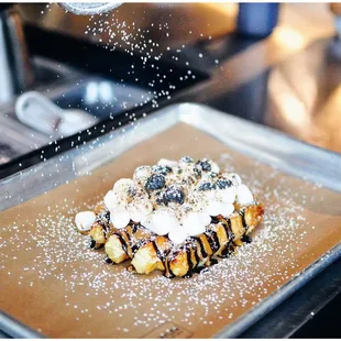 Happy Camper: Did someone say SMORES?! This dessert is topped with cookie butter, chocolate syrup, and perfectly toasted marshmallows!