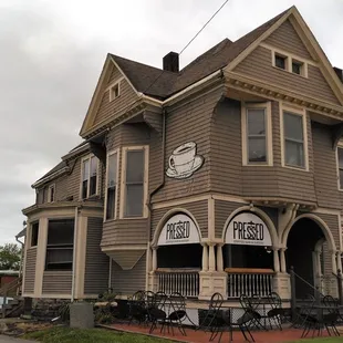 Nothing cookie cutter here.  This bohemian AF Victorian makes for a great coffeehouse.  In the foreground is the drive to their parking lot.