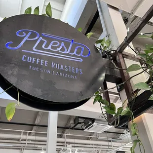 a sign for presta coffee roasters