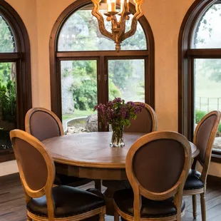 a dining room with a table and chairs