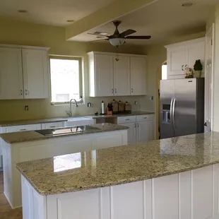 Giallo Ornamental 3cm Granite with Farm House Style Sink.