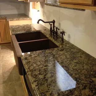 Portofino Granite with Farm House Style Copper Sink.