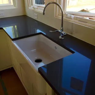 Absolute Back Granite with White Farm House Style Sink.