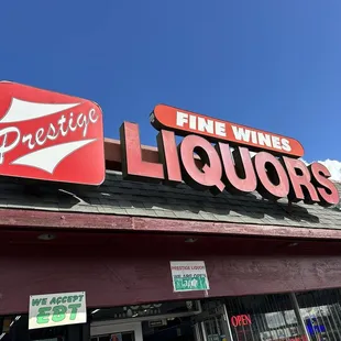 a sign on the outside of a liquor store