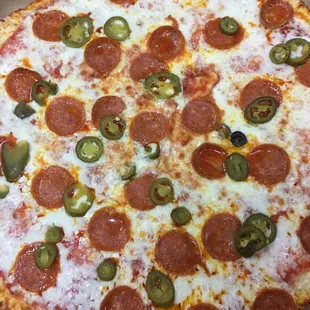 a pepperoni and jalapeno pizza