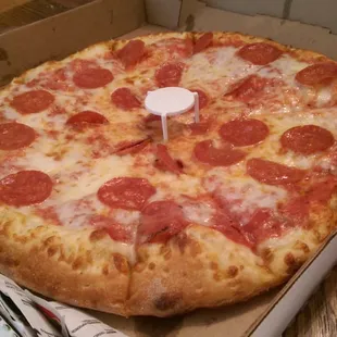 a pepperoni pizza in a box