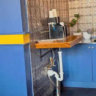 Water. Luke warm tap is free, cold is from thr cooler and is extra.