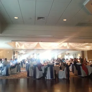 a large banquet hall with tables and chairs