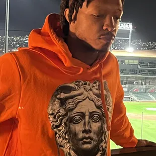 Orbit Orange Medusa Drip hoodie ...available in all sizes.