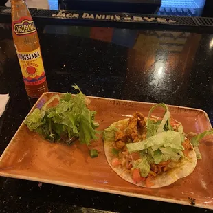Spicy chicken taco with Louisiana hot sauce