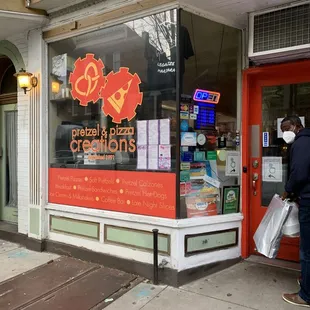 a man standing in front of a store