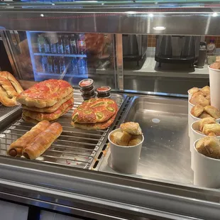 a variety of food items in a display case