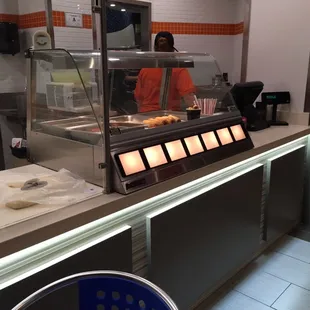 a man preparing food in a restaurant