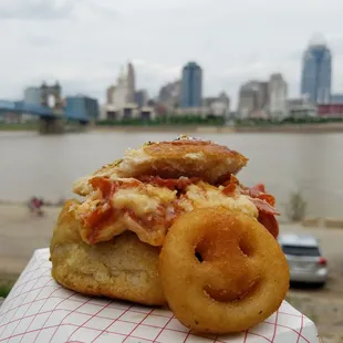 a close up of a sandwich with a river in the background