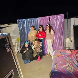 Party guests taking photos at the booth