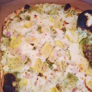 Build your own: pesto, mozzarella, artichoke and spinach, onion on half