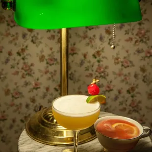 a green lamp and a bowl of soup