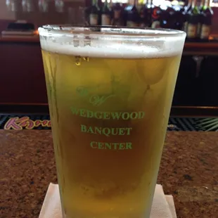 The glass cup has a golf ball bottom.