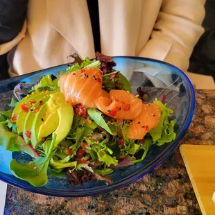 a plate of sushi and a glass of water