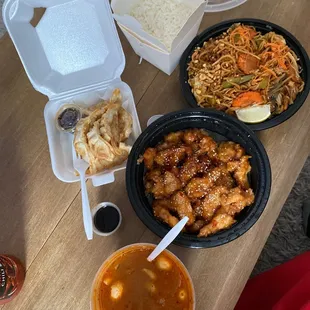 Sesame chicken, Pad Thai (vegetable) , Tom Yum soup, and Gyoza Gyoza (Chicken)