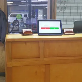 Service counter complete with electronic check in tablet.