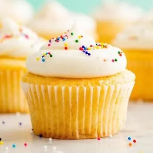 Sweet regular cake cupcakes with a rich creamy cream cheese icing on top.