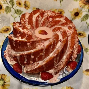 Fresh Strawberry cake that has Strawberries baked in along with fresh cream cheese with chopped strawberries in the icing!