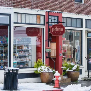 the outside of a restaurant in the snow