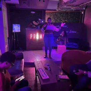 a group of people sitting in a living room