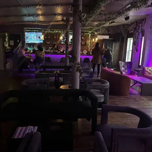 a bar with purple lighting
