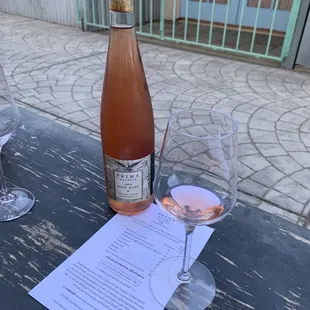 a bottle of wine and two glasses of wine