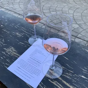 two glasses of wine on a table