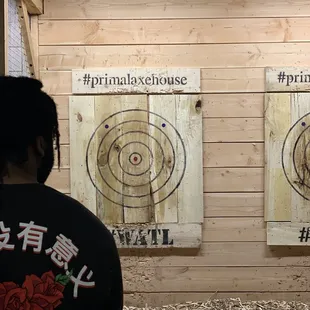 a man standing in front of targets