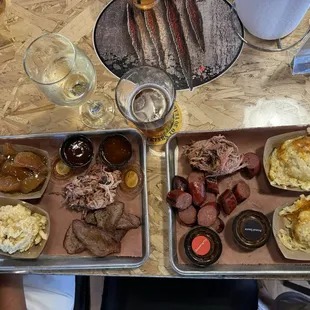 Pulled pork and tri-tip with Mac n cheese and bourbon apples. Pulled pork and hot links with cheesy potatoes