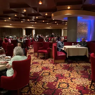 a large group of people sitting at tables