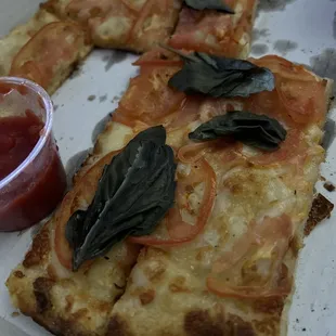 Cheese focaccia with tomato and basil added- the sauce though, OMG