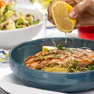 Lemon squeezed over Salmon Dill