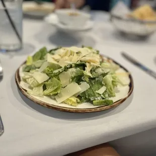 Starter Caesar Salad 8$ tons of cheese on it and pretty large. No need for a full salad unless ur sharing