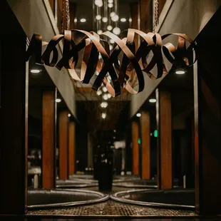 a hallway with a chandelier hanging from the ceiling