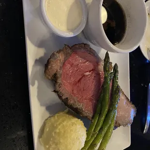 Prime Rib medium rare with garlic mashed potatoes and grilled asparagus