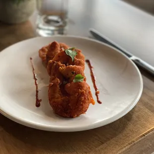 a plate of fried food on a table