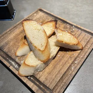 Complimentary toasted baguette with butter and parmigiana