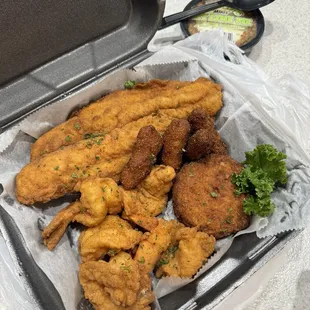 Seafood Platter:  fish, shrimp, hush puppies, and a crab cake.  Also had some waffle fries (not pictured)