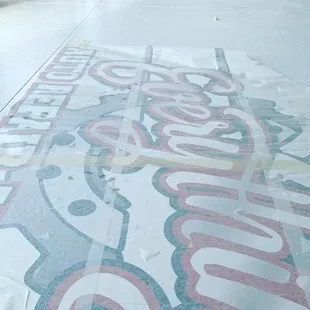 Complete fabrication and installation of commercial alupanel signs and floor vinyls for epoxy floor,