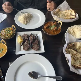 Rack of Lamb, garlic naan, cheese naan, lamb curry, and chicken soup.