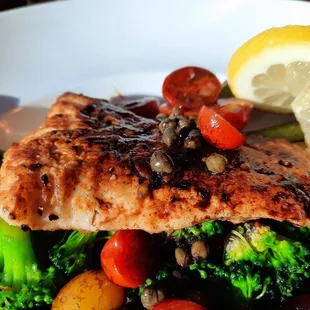 Halibut with capers, heirloom tomatoes, over broccoli and asparagus.