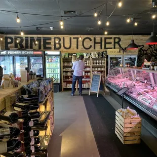 a woman in a butcher shop