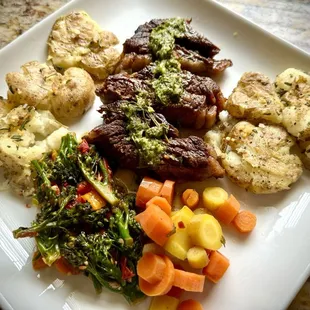 Dinner with my ribeyes topped with their house made chimichurri!! Divine!