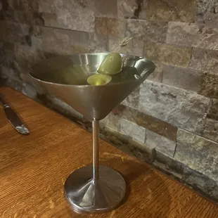 Dirty martini served in stainless steel (unbreakable)