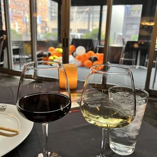 two glasses of wine on a table